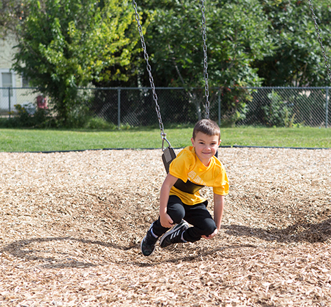 KHPS Central Feature2 060223 young male student on swing