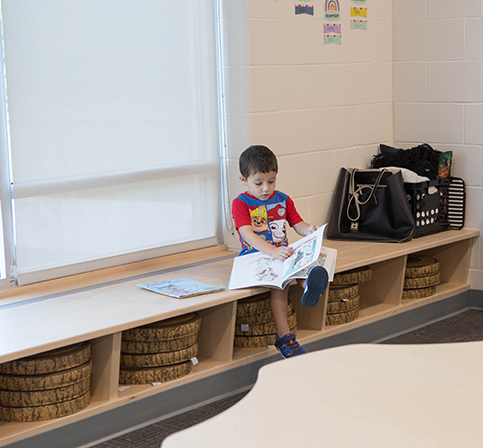 KHPS ECC Feature4 060223 young male student reading by the window